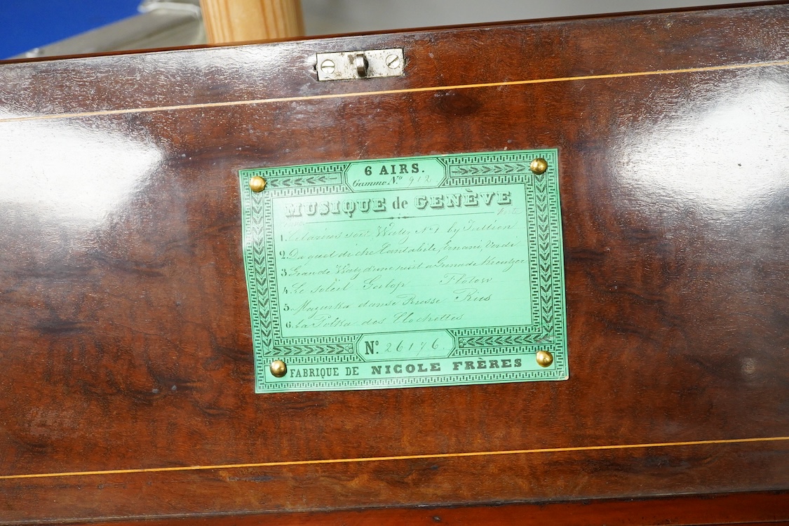 A 19th century Swiss cylinder music box by Nicole Freres, Geneve, key wound movement (with key present) playing six airs, in an inlaid rosewood case, cylinder 33cm long, the case; 52cm long, 13cm high, 17.5cm deep